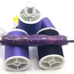 Sewing Seam Ripper / Purple Moon with 2 shades of Purple Epoxy and brass shavings. The seam ripper ends can flip and back into the shaft for protection.