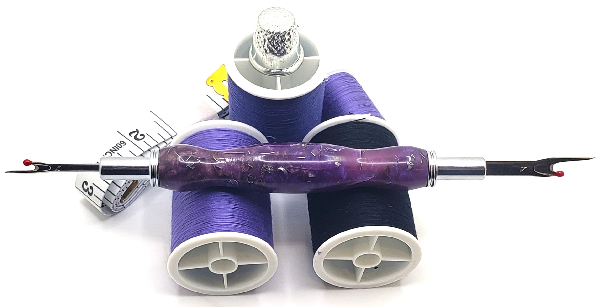 Sewing Seam Ripper / Purple Moon with 2 shades of Purple Epoxy and brass shavings. The seam ripper ends can flip and back into the shaft for protection.